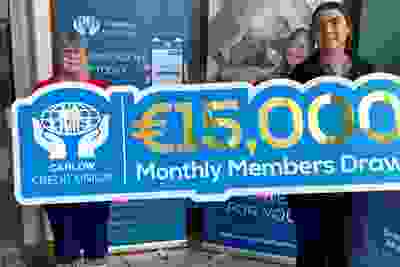 Car Draw Winner June 2026 Veronica Noctor holding 15,000 euro sign with staff member Orla O'Hara